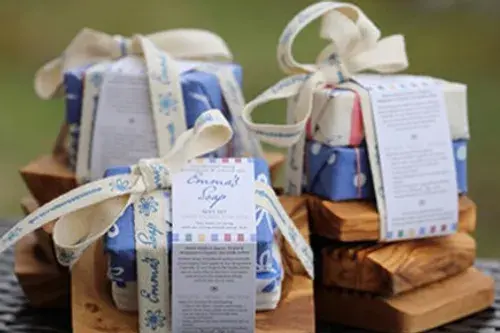 2 Bars of Jojoba soap on an Olive wood soap dish