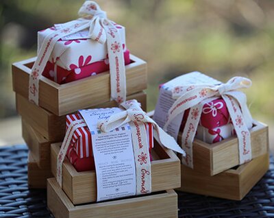 2 Bars of Rosehip soap on a Bamboo soap dish